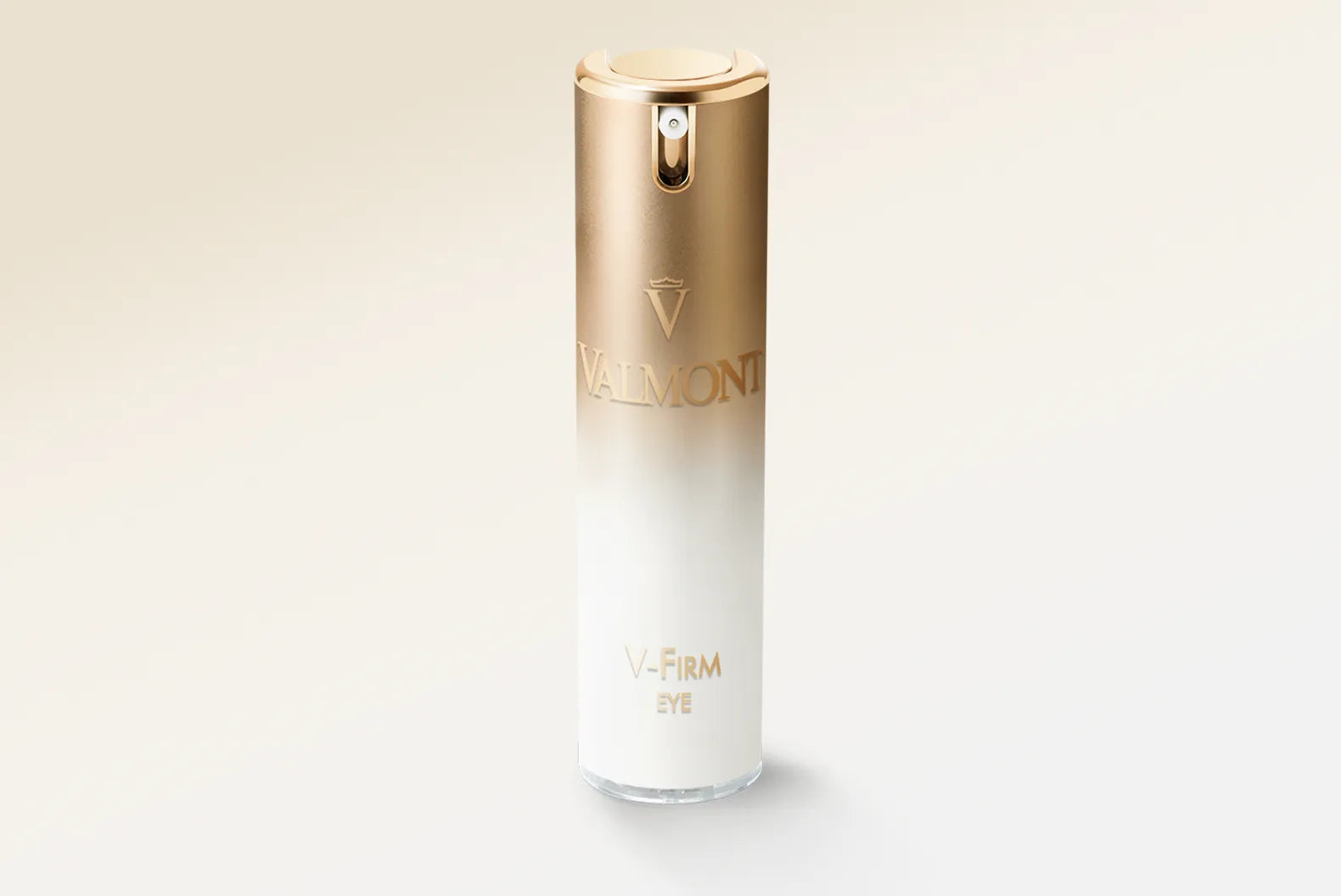 Skincare bottle with gold cap and white body on a light beige background
