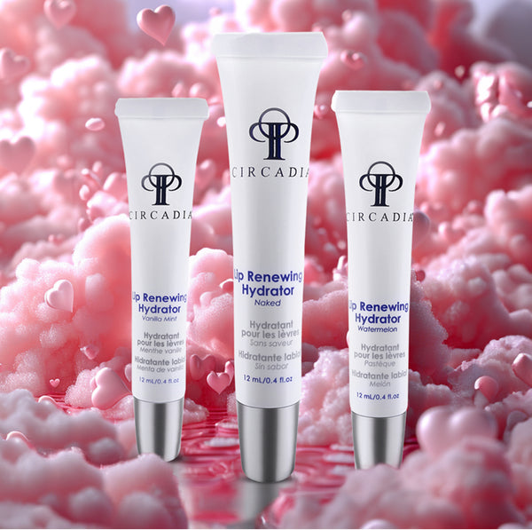 Three tubes of Circadia Lip Renewing Hydrator against a pink textured background with heart shapes.