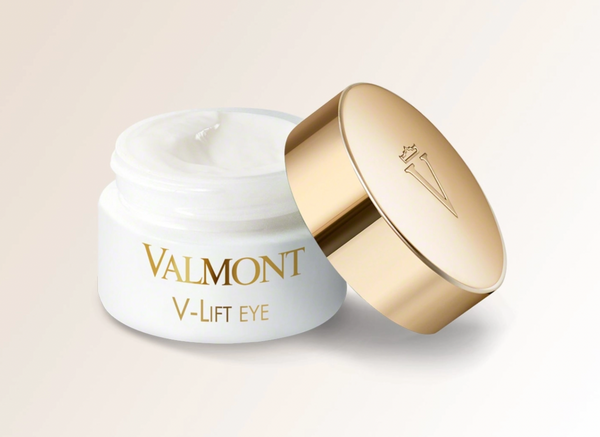 A jar of Valmont V-Lift Eye cream with a gold lid, indicating a luxury skincare product designed for the eye contour.