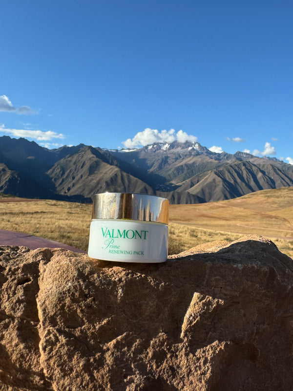Valmont Prime Renewing Pack on a rock with mountainous landscape in the background