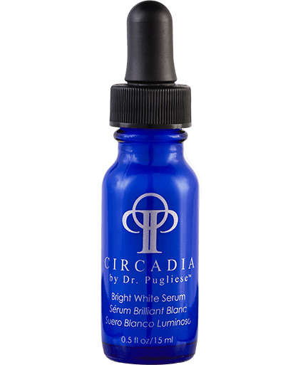A blue bottle with a dropper containing the 'Bright White Serum' by Circadia, with product information displayed on the label.