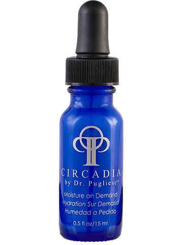 A blue bottle with a black dropper cap, labeled 'Moisture On Demand' by Dr. Puglise, indicating it is a skin hydration serum.