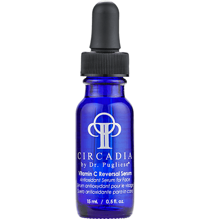 A blue bottle with a white label and dropper containing the Vitamin C Reversal Serum by Circadia.